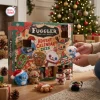 Front view of the Fuggler Funny Ugly Monster Advent Calendar 2026 box with open doors and plush toys on the floor.