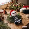 Closeup of a Funny Jack Skellington Crochet Penis Christmas Ornament resting on pine branches.