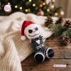 Handmade crochet phallic ornament wearing a Santa hat and striped suit with the name Ben.