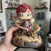 Front view of the Gaara Naruto Shippuden Hidden Sand Vinyl Figure held in a hand against a blurred room background.