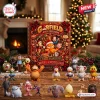 Front view of Garfield And Friends Christmas Advent Calendar with miniature figures displayed on a wooden table.
