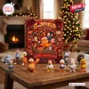 Front view of the Garfield And Friends Christmas Advent Calendar box with figures displayed on a wooden table.