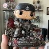 Front view of the Gears of War Marcus Fenix vinyl figure standing on a rubble base holding a rifle.