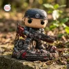 Front view of Gears of War Marcus Fenix vinyl figure standing on a rubble base in an outdoor setting.