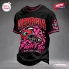Front view of a black Georgia Bulldogs Breast Cancer Awareness shirt featuring a football helmet, pink ribbon, and text.