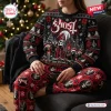 Front view of a person wearing a Ghost Band Christmas sweater and jogger set with gothic holiday graphics.