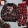 Flat lay of Ghost Band Christmas Sweater and Jogger Set featuring red and black festive motifs.