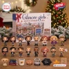 Front view of Gilmore Girls Advent Calendar 2026 box with 16 miniature figurines and themed props on a wooden surface.