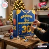 Front view of Golden State Warriors Steph Curry Advent Calendar on a wooden table with opened compartments.