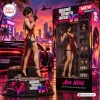 Side view of a collectible figure in a red dress with packaging box, next to a sports car and cityscape background.