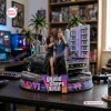 Front view of Grand Theft Auto VI collectible figure featuring two characters, a black car, palm trees, and an Ocean View building.