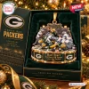 Detailed closeup of the Green Bay Packers Ice Bowl Christmas Ornament inside a green gift box.