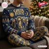 Front view of a person wearing a blue and gold Greta Van Fleet Christmas sweater and jogger pants set indoors.