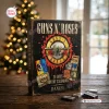 Front view of a Guns N Roses cassette tape advent calendar on a wooden table with string lights.