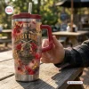 Hand holding a Guns N Roses tumbler with red roses and revolver design.