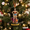 Front view of the Hallmark Wonder Woman 50th Anniversary Ornament hanging on a lit Christmas tree.