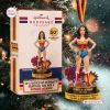 Front view of the Hallmark Wonder Woman 50th Anniversary Ornament figurine standing beside its retail packaging box.