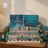 Front view of Hatsune Miku Magical Advent Calendar with opened box and 24 miniature figures displayed on a tiered wooden stand.