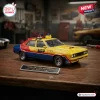 Three-quarter front view of the Hot Wheels 1979 Ford Falcon XB Sedan Diecast Car with MFP police livery on a wooden table.