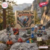 Front view of an It's Climbing Time mountaineering advent calendar surrounded by miniature climbing gear figurines on a rocky outdoor setting.
