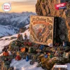 Outdoor view of It's Climbing Time Mountaineering Advent Calendar box surrounded by miniature climbing gear figures on snowy rock.