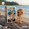 Vinyl figure and packaging box on a beach log.