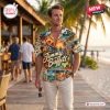 Man wearing a Jimmy Buffett Island Life Hawaiian shirt with sunset graphic motifs.