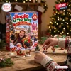 Front view of Jingle All The Way 30th Anniversary Advent Calendar 2026 with miniature holiday figurines on a wooden table.