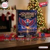 Front view of Journey Band 2027 Advent Calendar box with assorted music themed enamel pins arranged on a wooden table.