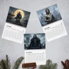Flat lay of three open pages from the 2027 wall calendar featuring historical fantasy illustrations.