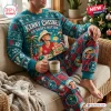 Front view of person wearing a Kenny Chesney No Shoes Nation Christmas sweatshirt and jogger set holding a mug.