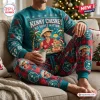 Front view of a person wearing a teal Kenny Chesney No Shoes Nation Christmas sweatshirt and plaid jogger set.