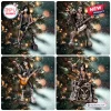 Four panel view of KISS Band Members Christmas Ornament hanging on a lit pine tree branch.