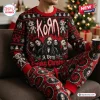 Front view of the Korn Red 2026 Christmas Sweater and Jogger Set worn on a couch.