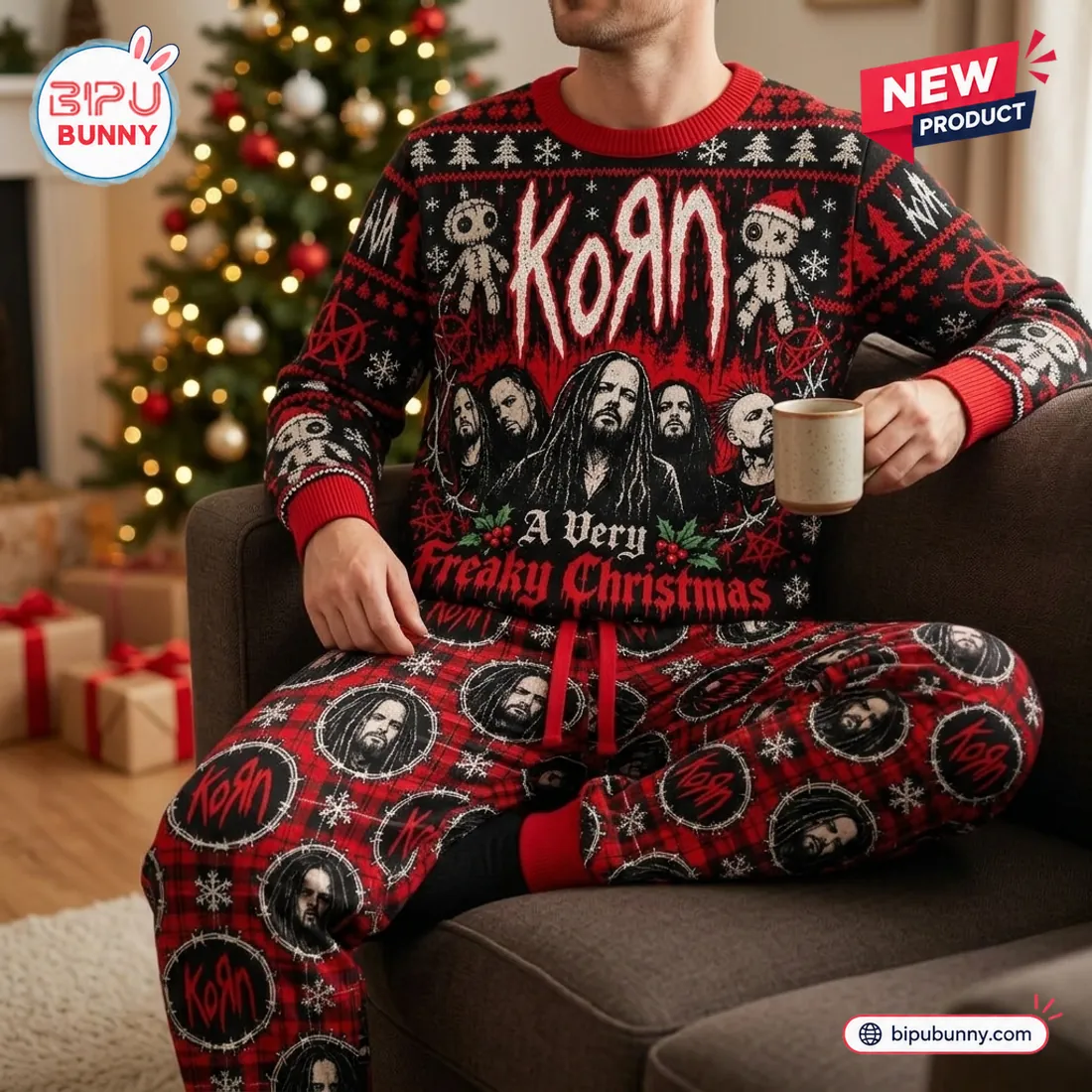 Man wearing matching KoRn Christmas sweater and jogger set relaxing in an armchair by the holiday tree