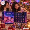 Two smiling women opening a blue Kpop Star Guardians Advent Calendar 2026 with numbered boxes.