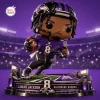 Front view of Lamar Jackson Baltimore Ravens vinyl figurine running on a lighted stadium base.