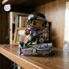 Front view of Lamar Jackson Baltimore Ravens vinyl figurine on a miniature football field base.