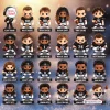 Grid of twenty-four chibi football figurine characters wearing black and white jerseys.