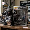 Front view of Las Vegas Raiders Gorilla Rilla Vinyl Figure next to its box on a wooden surface.