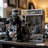 Front view of the Las Vegas Raiders Gorilla Rilla Vinyl Figure outside its box with a matching packaging box beside it.
