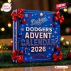 Front view of blue Los Angeles Dodgers 2026 Advent Calendar decorated with red bows and holiday motifs.