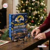 Front view of Los Angeles Rams Advent Calendar 2026 with miniature figurines on table near a tree.