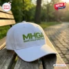Front view of the Make Halo Great Again White Baseball Cap resting on a wooden park bench.