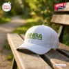 Front view of a Make Halo Great Again white baseball cap resting on a wooden park bench.