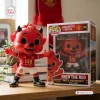 Front view of the Manchester United Fred The Red vinyl figure standing next to its branded box.