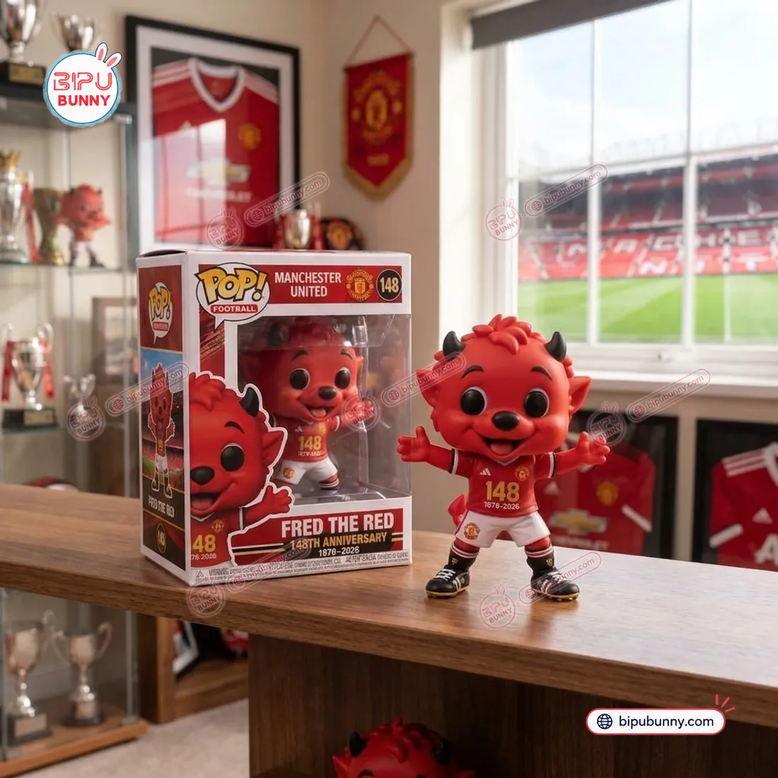 Manchester United Fred The Red 148th Anniversary 3D vinyl figure standing beside its #148 collector window box on a trophy room shelf