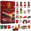 Front view of the Manchester United Red Devils Old Trafford 2026 Advent Calendar box alongside collectible figures and items.