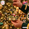 Close-up view of a Marshawn Lloyd Green Bay Packers Christmas Ornament hanging on a tree.