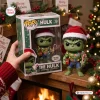Front view of Marvel The Hulk Christmas Elf Vinyl Figure next to its decorated box in a holiday setting.